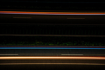 Night road lights. Lights of moving cars at night. long exposure multicolored