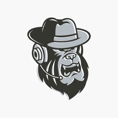 Gorilla head mascot in hat wearing earphones in black and white.