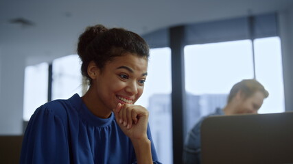 Businesswoman reading good news on laptop screen. Woman using computer 