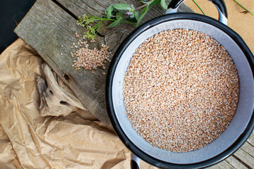 Buckwheat groats in a metal pot 