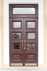 closed brown double-leaf door in a classic style