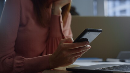 Businesswoman hands texting on cellphone. Woman browsing internet on smartphone 