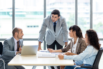 Businesspeople discussing together in the conference room during meeting at the office.