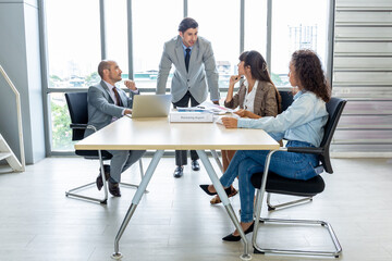 Businesspeople discussing together in the conference room during meeting at the office.