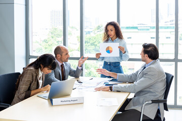 Businesspeople discussing together in the conference room during meeting at the office.