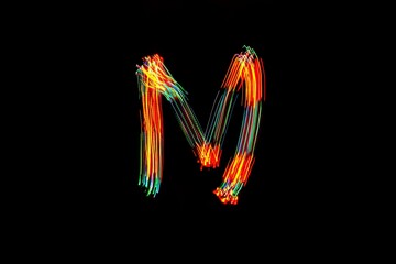 Letter M. Light painting alphabet.