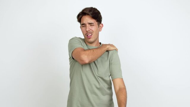 Young man with shoulder pain over isolated background