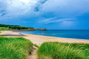 Beach on the Atlantic Ocean in rural Cape Breton, Nova Scotia, Canada on a beautiful summer's day in August