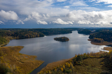 Fototapeta na wymiar Landscape Of Karelia. Panorama of the lake and Islands from the drone. Nature of Russia. Lake district. Autumn landscape from the air. Big lake on a cloudy autumn day. Ladoga lake.
