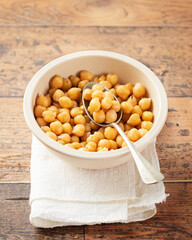 Cooked Chickpeas on a bowl wooden rustic background. copy Space, selective focus. Nutrition, Healthy, vegetarian food concept.