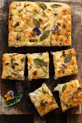 Freshly baked focaccia with herbs and flowers