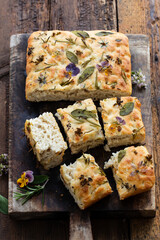 Freshly baked focaccia with herbs and flowers
