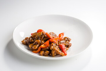 Chinese Deep Fried Pork With Sweet and Sour Sauce and pepper isolated on white background