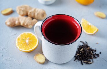 Cup of black tea with honey, lemon and ginger
