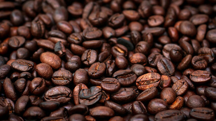 Roasted coffee beans background, texture with copy space.