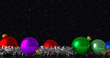 Image of christmas baubles decorations with snow falling on black