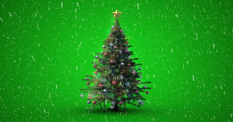 Image of decorated christmas tree with snow falling on green