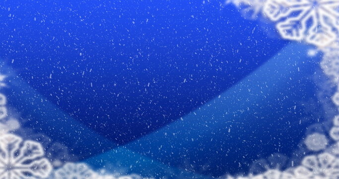 Image of winter scenery with snow falling on blue background