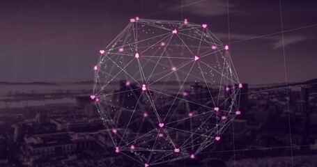 Globe of digital icons against cityscape