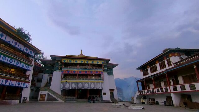 ancient colorful buddhist monastery with dramatic sky time lapse at morning