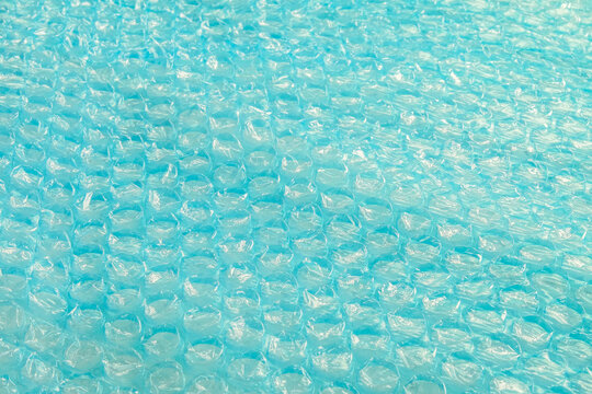 Transparent plastic bubble wrap packing tape colored in blue.