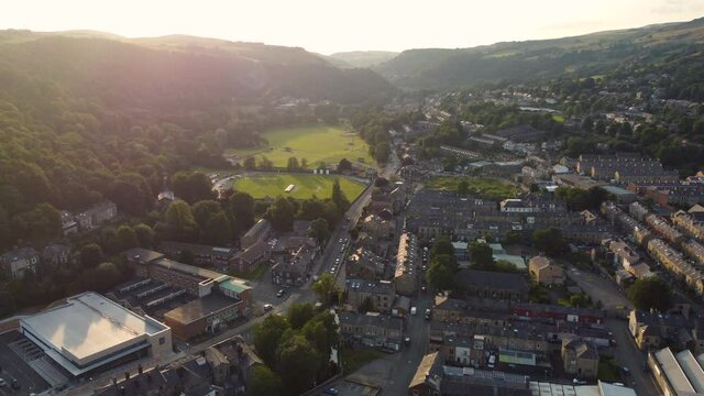 Aerial view of a Yorkshire town at sunset. Todmorden and it's park and cricket ground, near Halifax and Rochdale