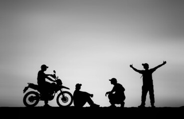 Fototapeta na wymiar Silhouette Man traveling motocross multiple poses on sky