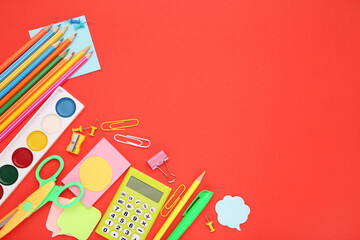 School supplies on red background