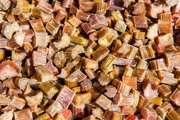 Chopped and candied rhubarb as candied fruits. Natural background of dried fruits.