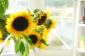 Bouquet with large sunflowers in a vase
