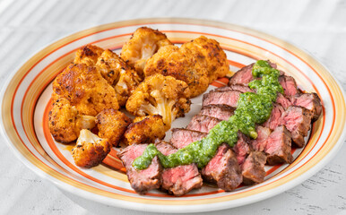 Sliced beef steak with baked cauliflower