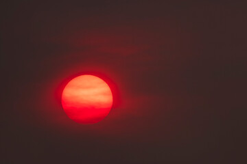 Red sun rising over the Salish Sea during wildfires in the Pacific Northwest
