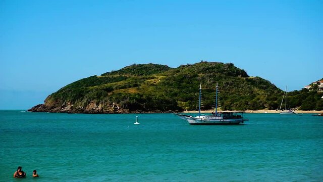 Ferradura Beach - Buzios, Rio de Janeiro in Brazil
Small ship and bathers 