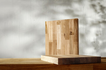 Wooden pedestal on a wooden table in an interior with sun rays 