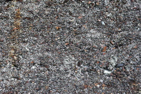 The old wall is made of slag (slag, a product obtained by burning coal in a furnace). Construction concept from natural materials.
