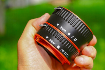 The macro rings of the dlf camera are made of black and red plastic