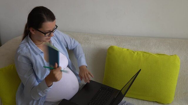 Tired stressful Stressed upset Pregnant business Woman With Laptop rest on Sofa. Depressed Ledy In Pregnancy Work Remotely Using Smartphone Internet Online Technology At Home. Maternity leave Concept
