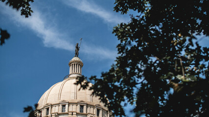 The Watcher statue over the Oklahoma Capitol Building - obrazy, fototapety, plakaty