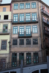 Fototapeta na wymiar Traditional facade of buildings in the narrows street of downtown Porto