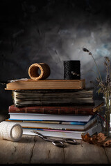 Stack of books and lavender on wooden table