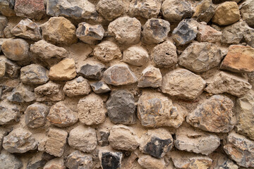 Close up of an old brick wall in Honfleur, France, for an abstract background texture.
