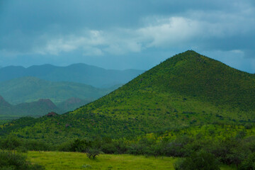 Obraz premium Green Hills landscape with clouds