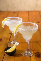 cozumel glasses, mojito with tequila, gin, refreshing with lemon and victo mint from above blurred drink in the background seen from above