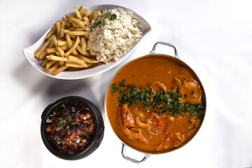 fish stew with spiced herbs Brazilian food seafood rice and spiced beans Moqueca