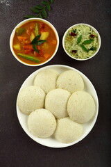 Kerala foods- homemade delicious idly, idly sambar and coconut chutney . healthy vegetarian breakfast.