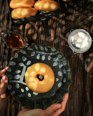 Doughnut or Donut or Donat is a Fried Snack, Made from a Mixture of Flour, Sugar, Eggs, and Butter. The Most Common Donuts are Ring Shaped Donat Kampung with a Hole in the Middle.