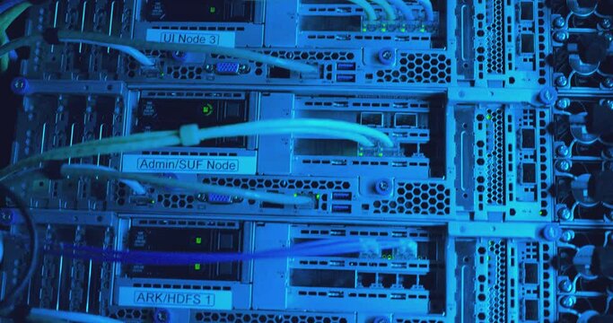 Close-up view of modern internet network switch with plugged ethernet cables. Blinking green lights on internet server. Optical server. Commutator. Flashing lights. Optical fiber. Video IP Gateways.