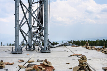 Foundation of a mobility cell site on a shale covered mountain top, coax and cable tray
