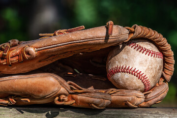 Baseball in old leather baseball glove