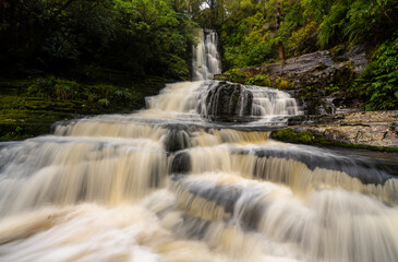 Fototapeta na wymiar McLean Falls after heavy rain the waterfall is in full flow in the Catlins New Zealand